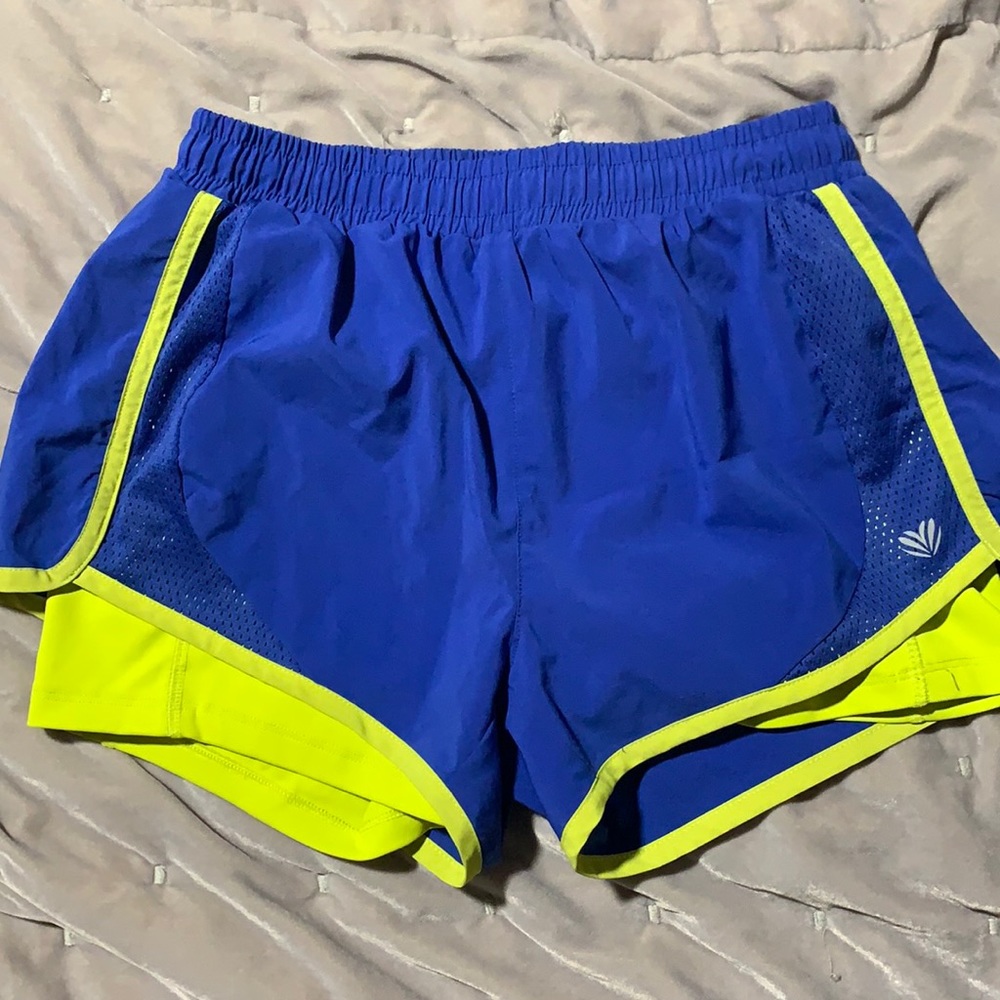 Athletic shorts with built in compression shorts.